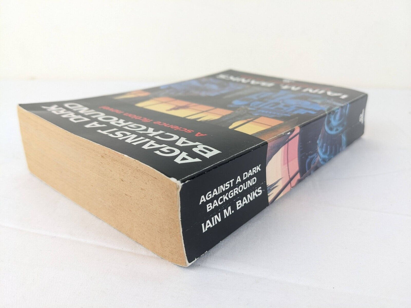 Against a dark background by Iain M. Banks 1993