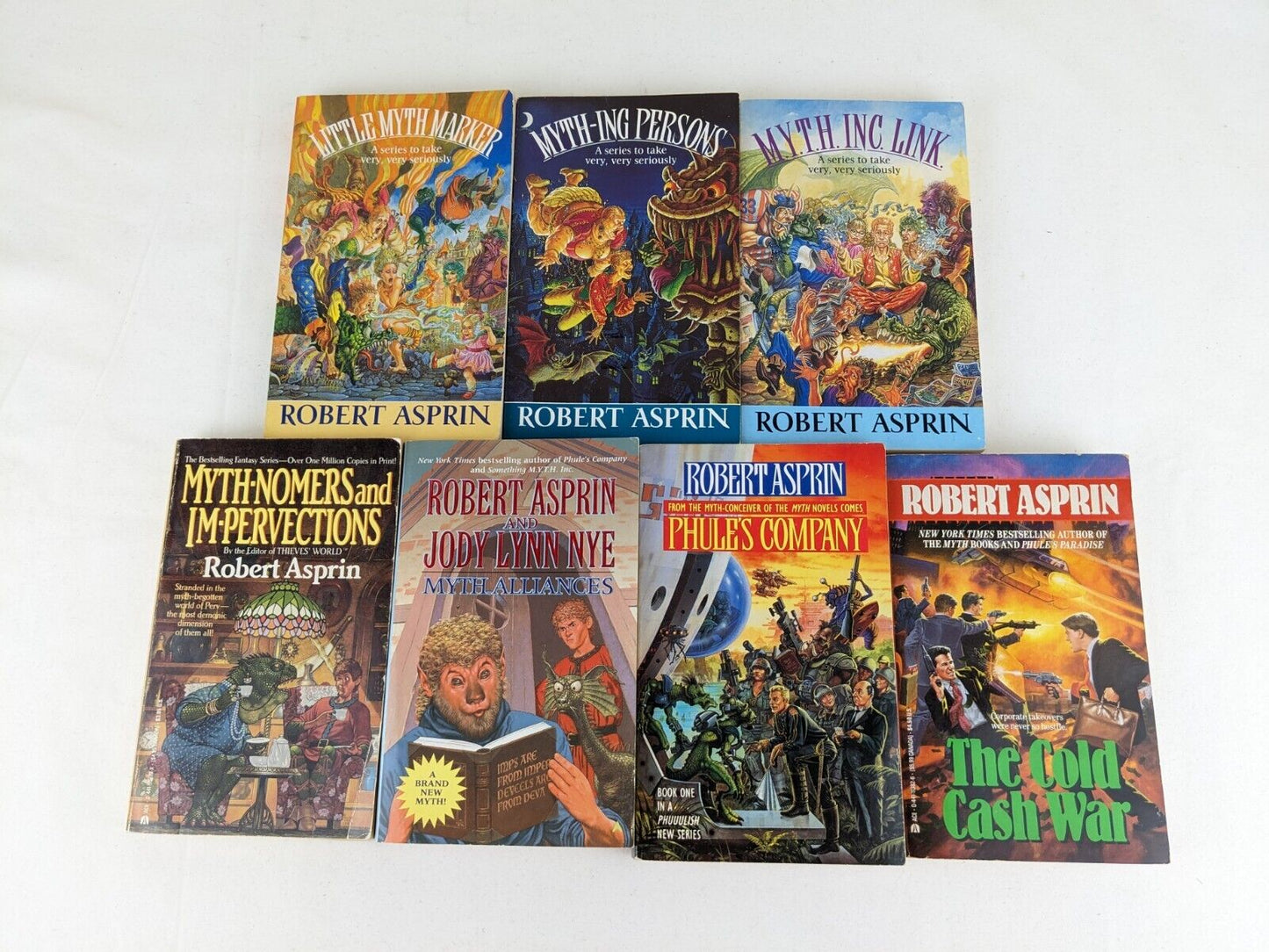 Myth adventures x 6 & Phule's company & cash war by Robert Asprin 1991