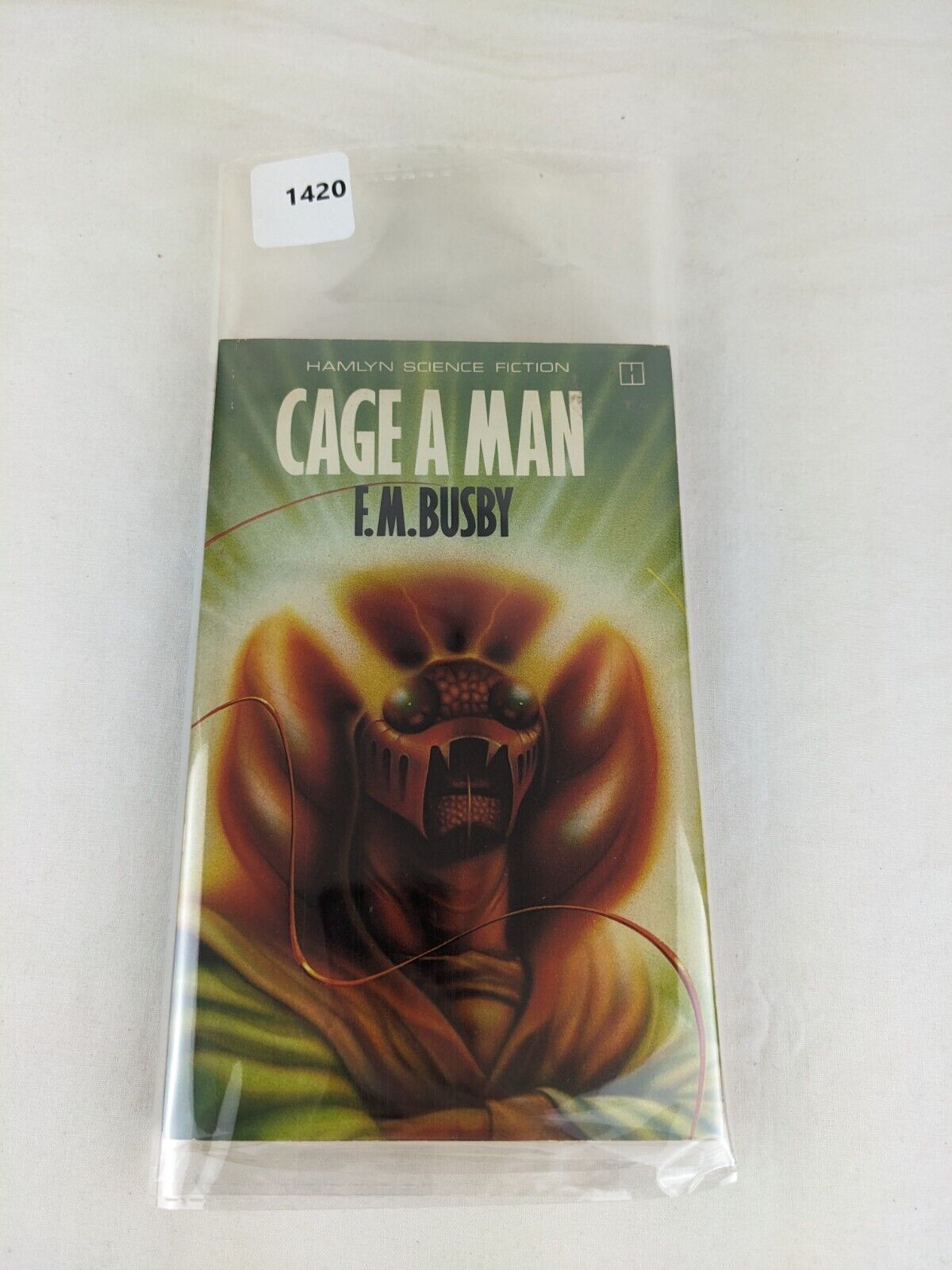 Cage a man by F.M. Busby 1979 Demu trilogy